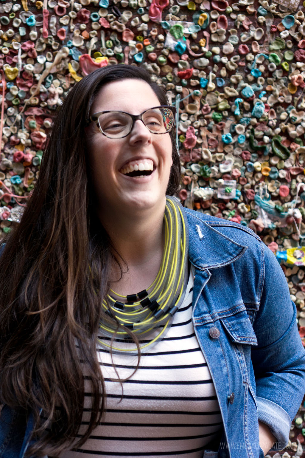 woman standing in front of the gum wall in Seattle