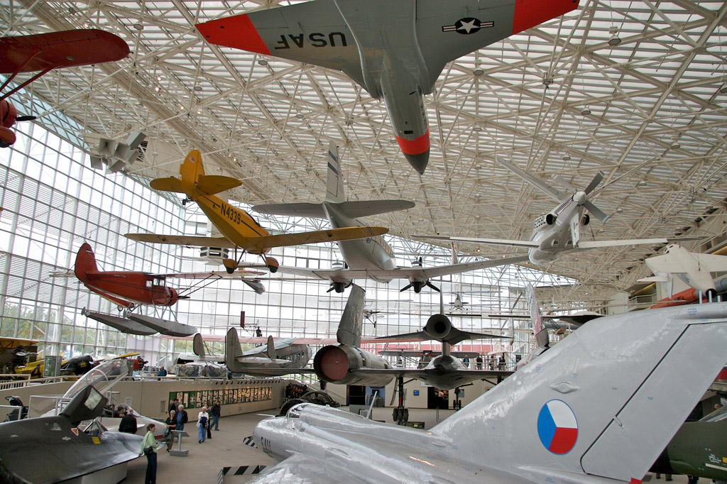 a bunch of planes hanging in the Museum of Flight