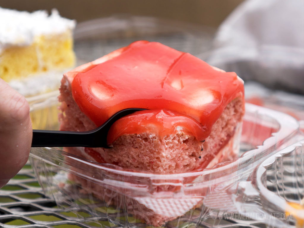 fork slicing into cake from a Black-owned restaurant in Seattle