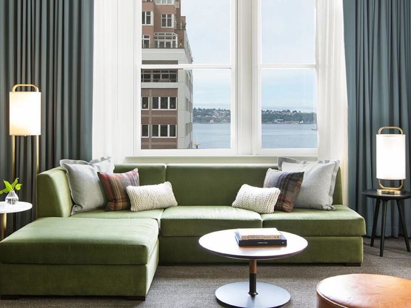 view of a couch with water views behind it at a green hotel in Seattle