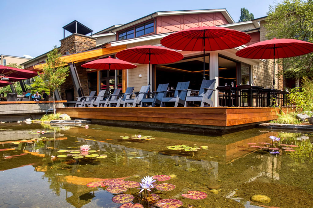 exterior shot of Cedarbrook Lodge and its pond and patio