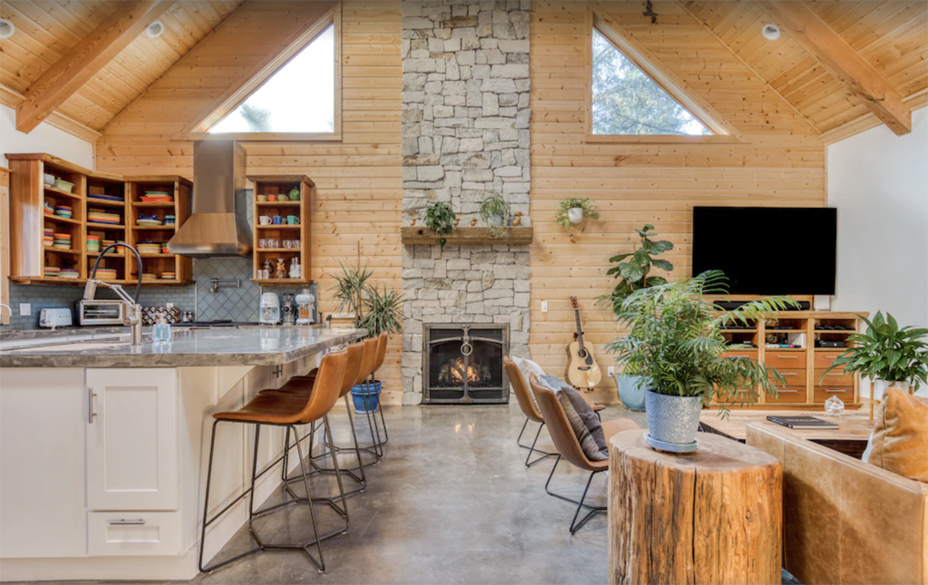 Great room inside a cabin on the Washington coast with a floor-to-ceiling fireplace