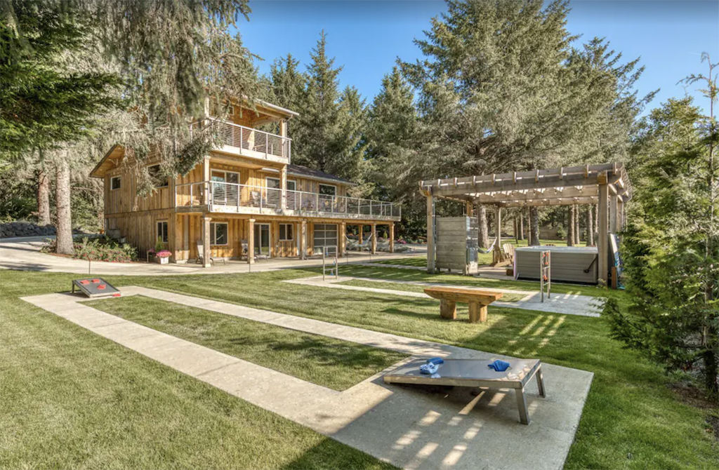 yard of a two-story Washington coast cabin