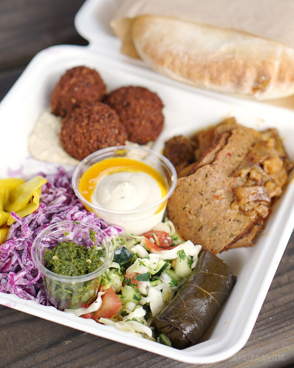 plate of Mediterranean food in Seattle: gyro, falafel, dolma, salad, shawarma, and more