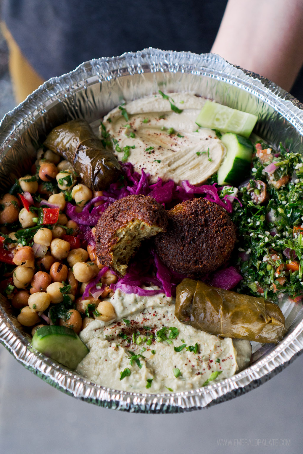 mezze plate of falafel, hummus, tabbouli, dolma, and baba ganoush