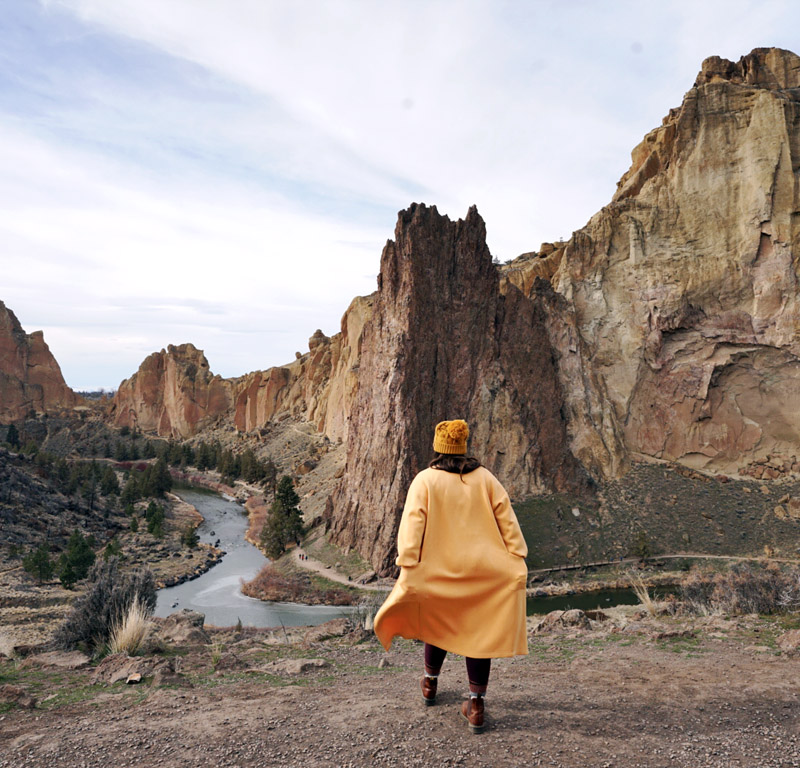 woman walking in a state park that is one of the best road trips from Seattle