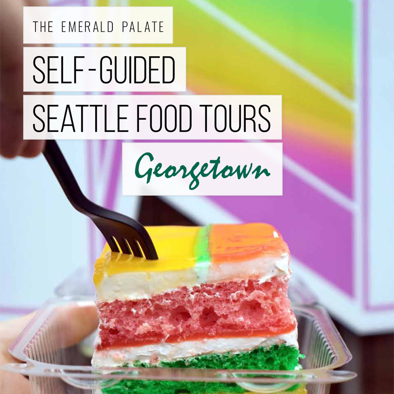 person diving fork into colorful layered cake from a restaurant on The Emerald Palate's self-guided Seattle food tour of the Georgetown neighborhood