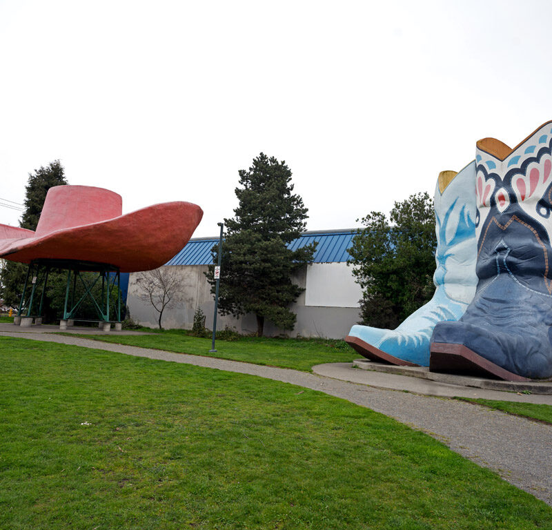 cowboy hat and boots sculptures in a park, one of the most unique things to do in seattle