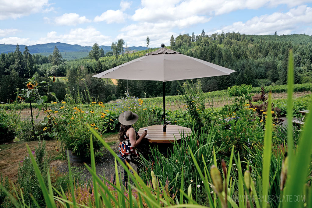 woman drinking wine in a garden