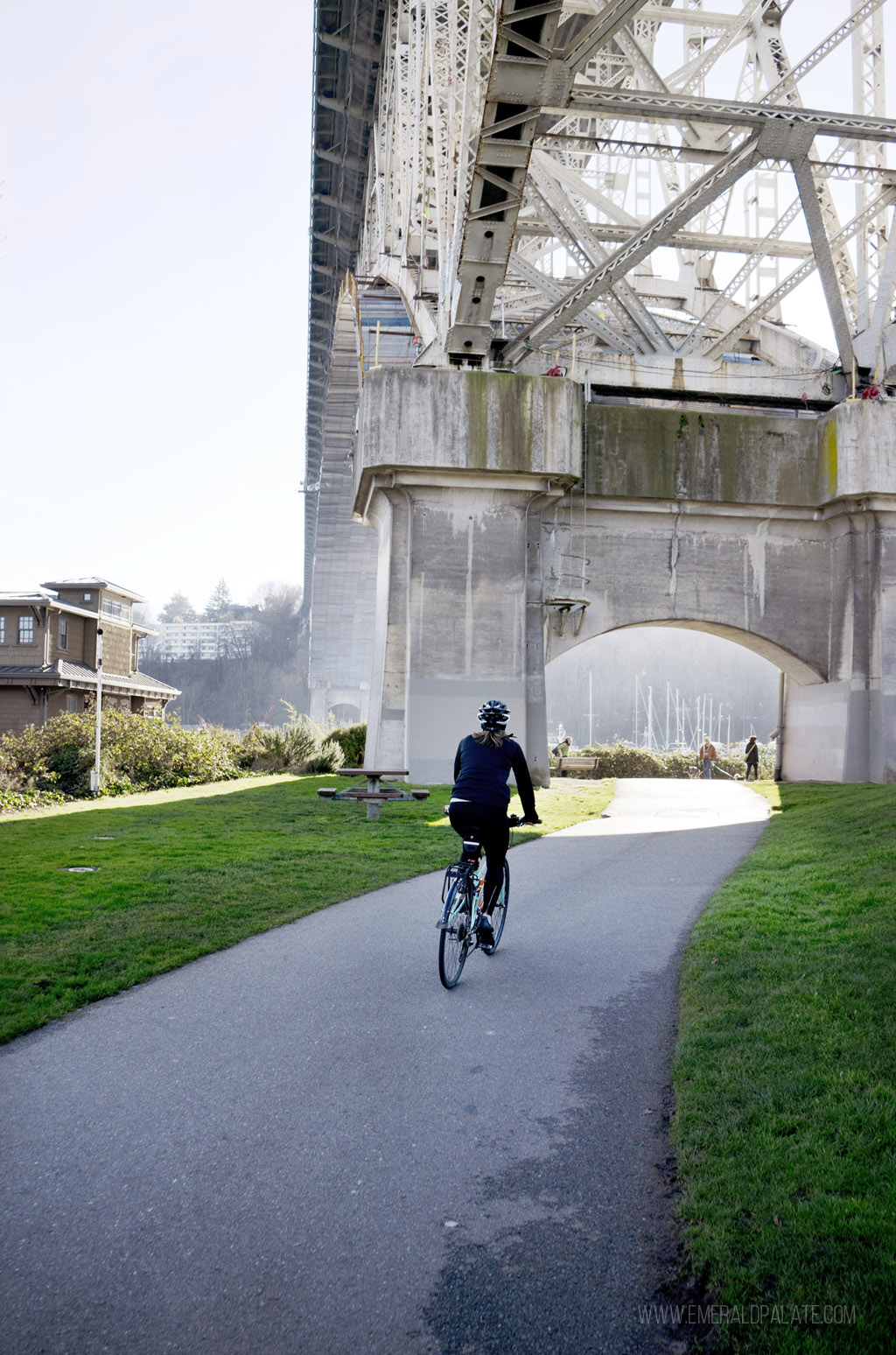 person biking along the Burke-Gilman Trail, one of the top things to do in Fremont, Seattle