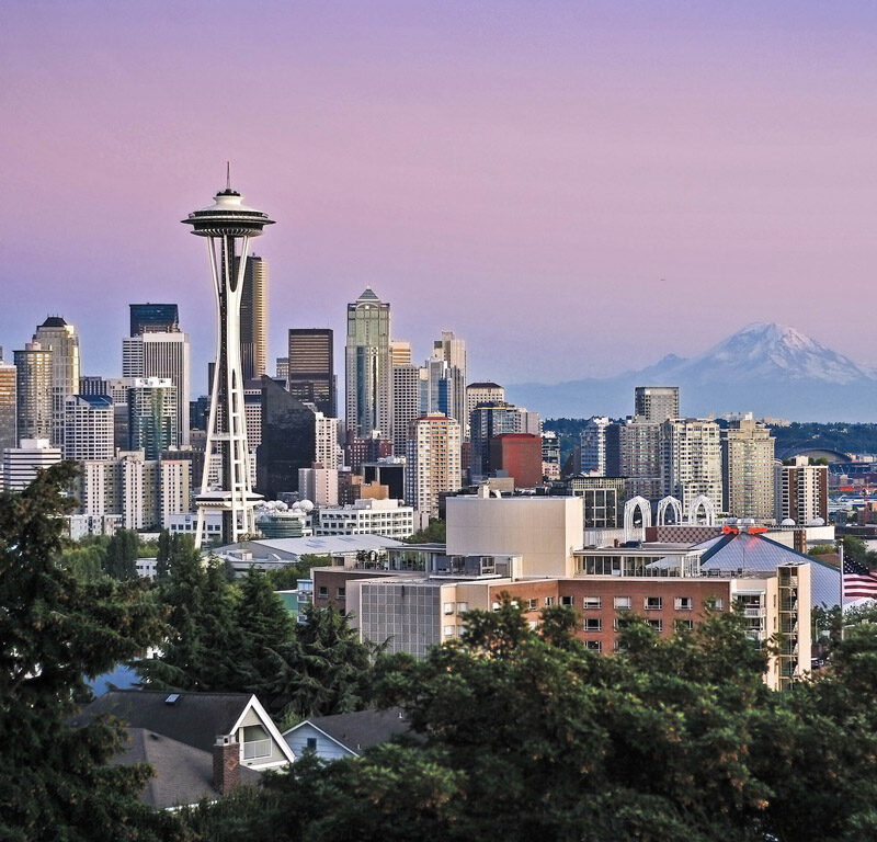 Seattle skyline at sunset, a fitting picture for an article with fun facts about Seattle
