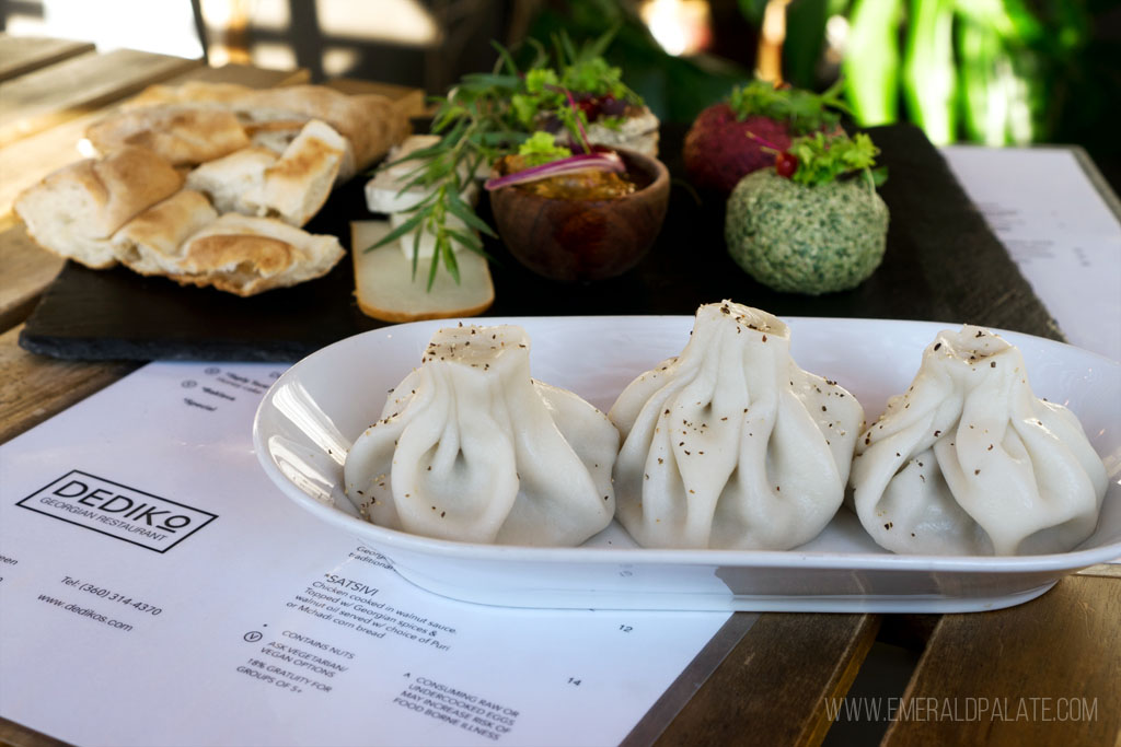 plate of three Georgian dumplings with dips