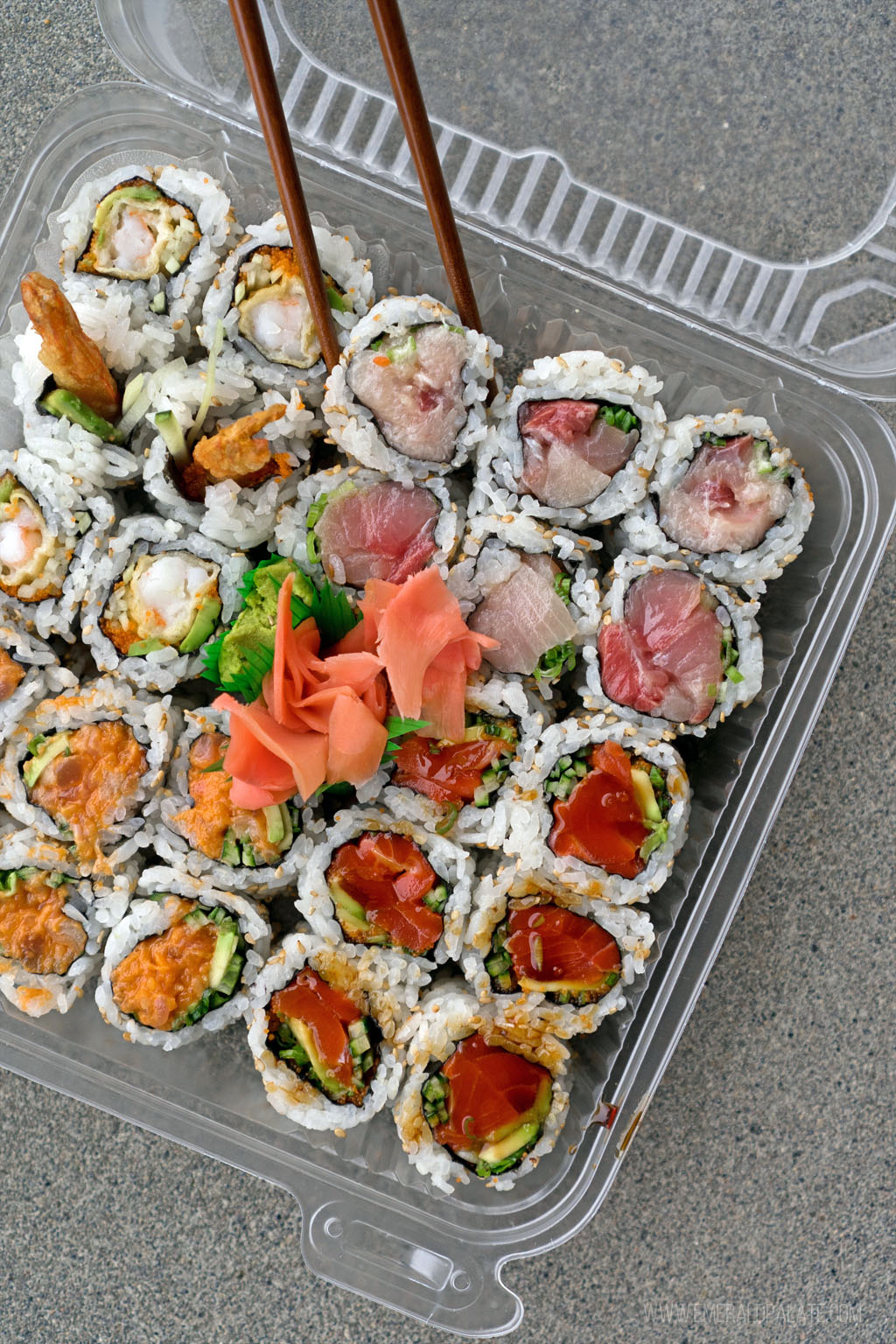 takeout container of sushi rolls from one of the best sushi restaurants in Seattle