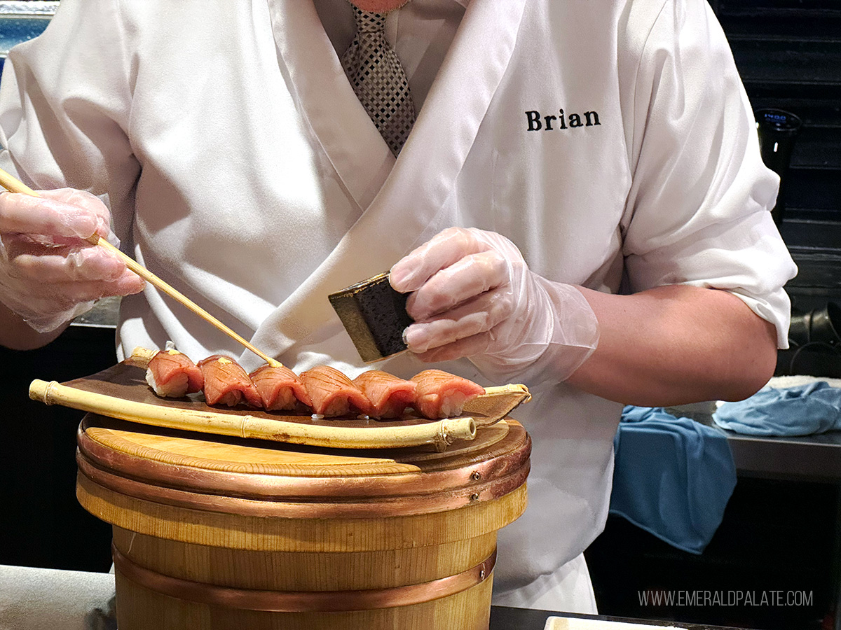 chef preparing nigiri sushi pieces