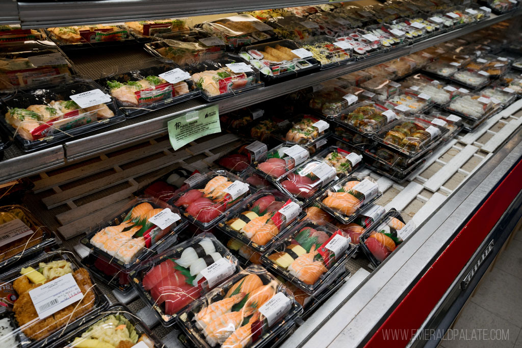 case of sushi to go at a Japanese convenience store