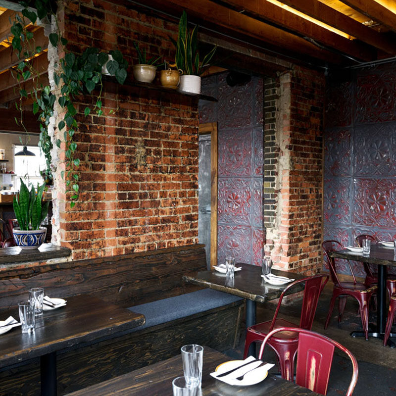a moody and romantic space that's one of the cutest restaurants in Seattle