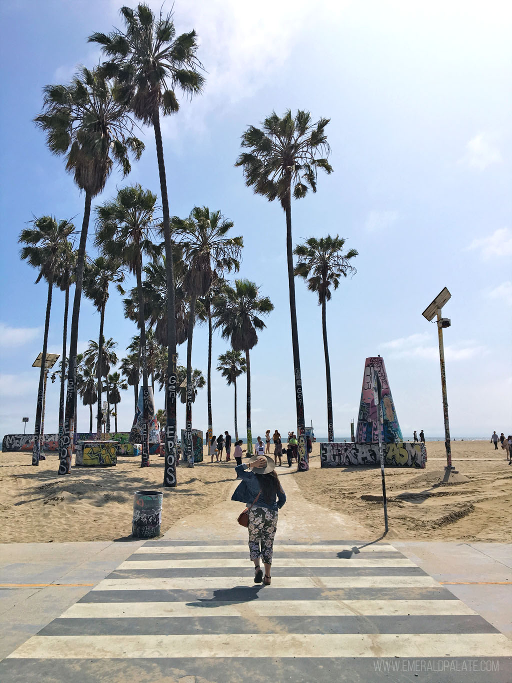 woman crossing the street to go to Venice Beach during a 4 day Los Angeles itinerary