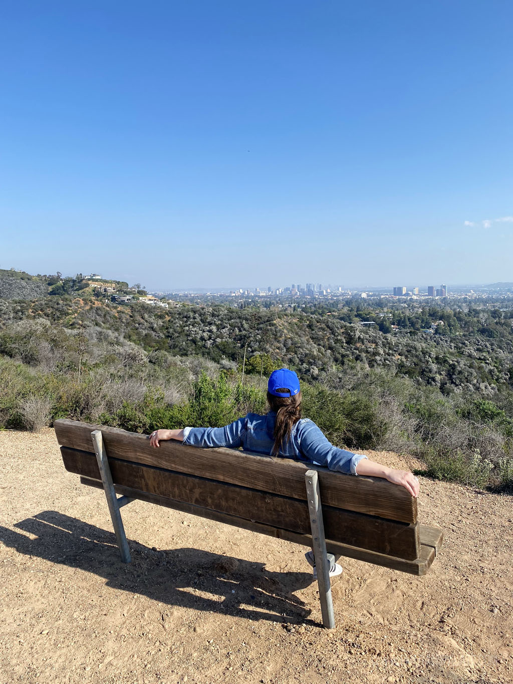 woman enjoying views of LA from Inspiration Point, must visit during your 4 day Los Angeles itinerary