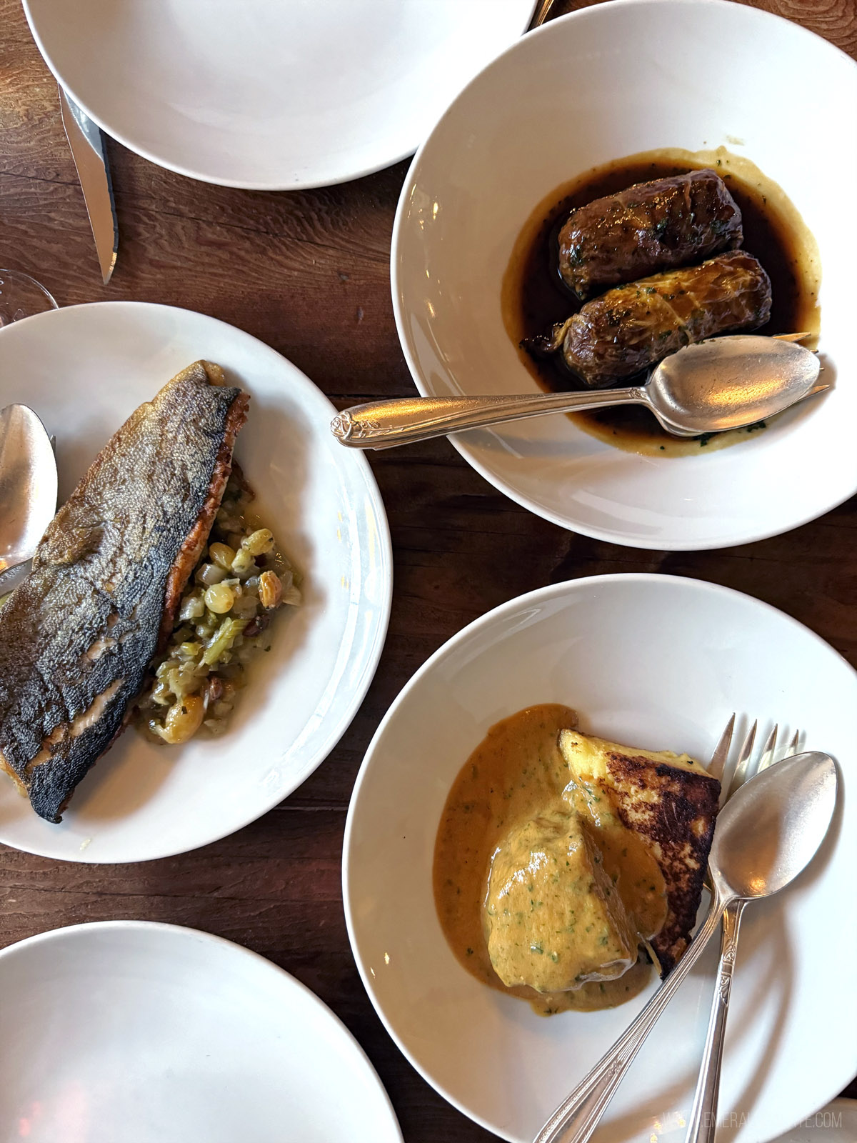 fish, cabbage rolls, and pork dishes at an Italian restaurant in Seattle