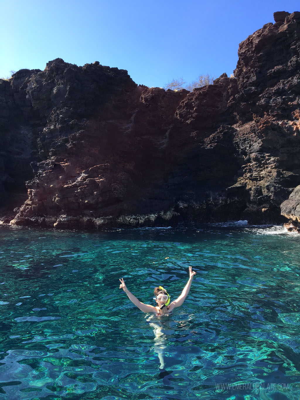 woman snorkeling at Molokini Crater, one of the best snorkeling spots on Maui