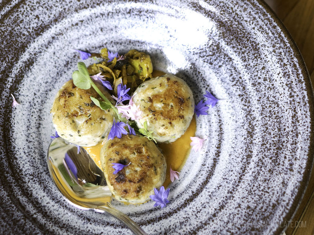 3 fancy crab cakes from one of the farm-to-table restaurants in Seattle