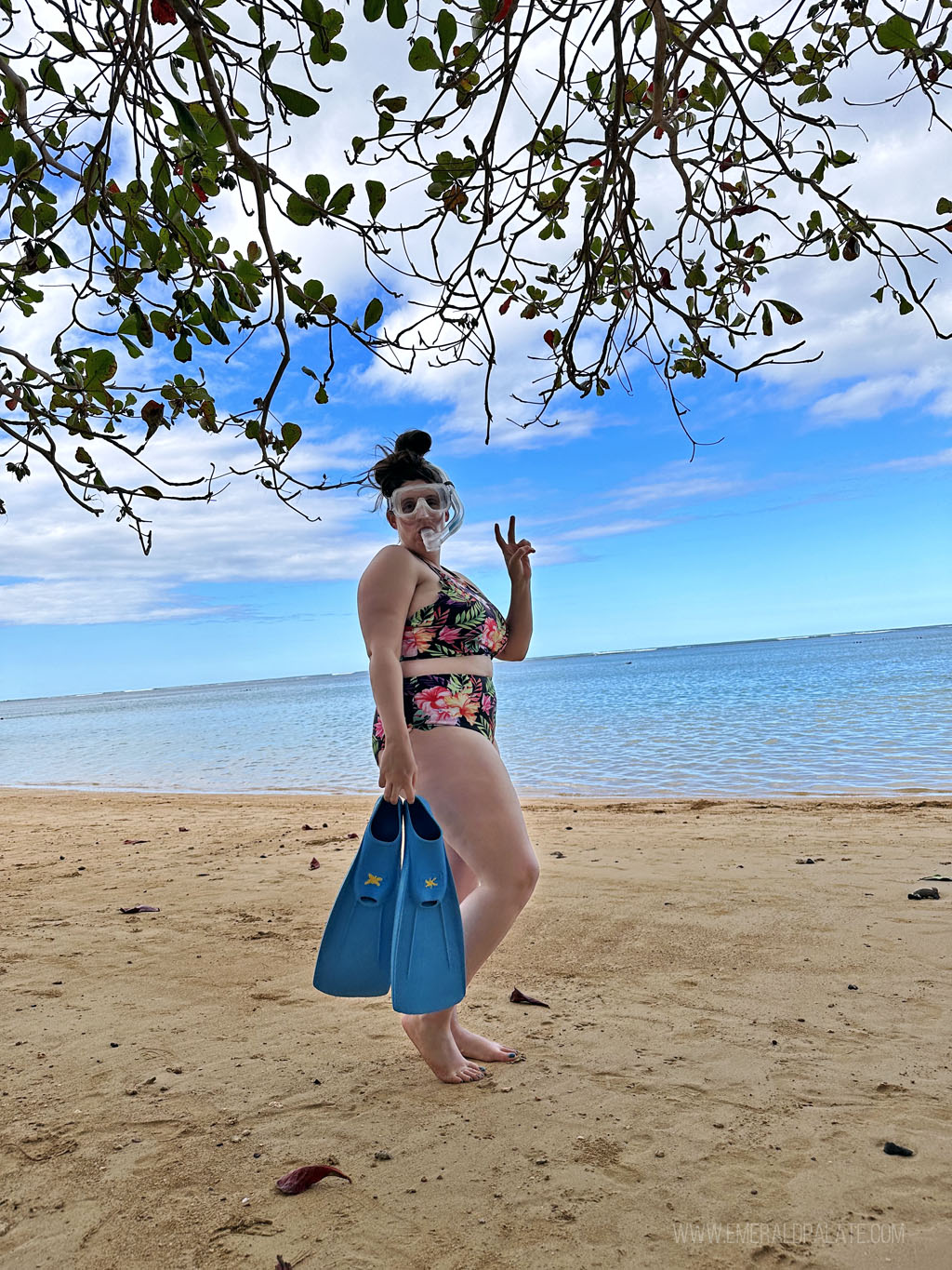 woman on a beach in snorkel gear in Hawaii