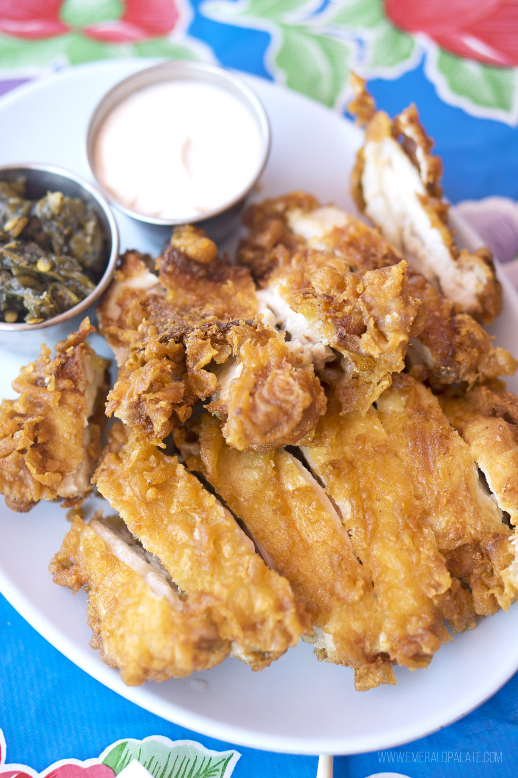 plate of fried chicken on a colorful plastic table cloth