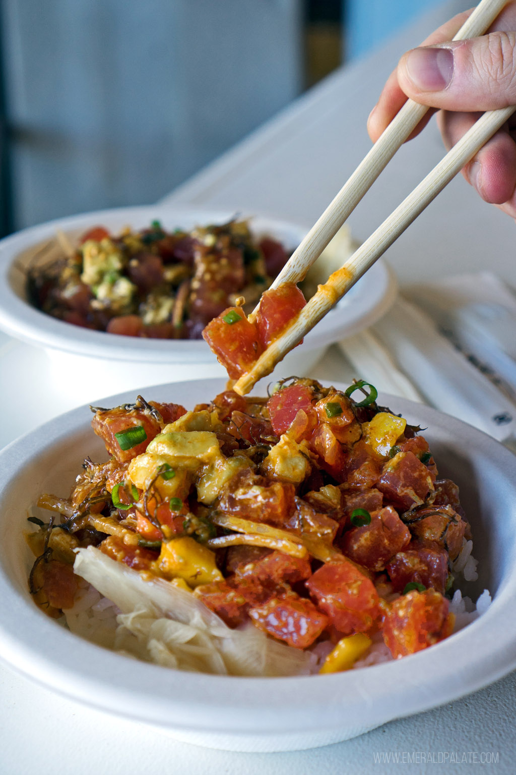 Hawaiian poke being picked up with chopsticks