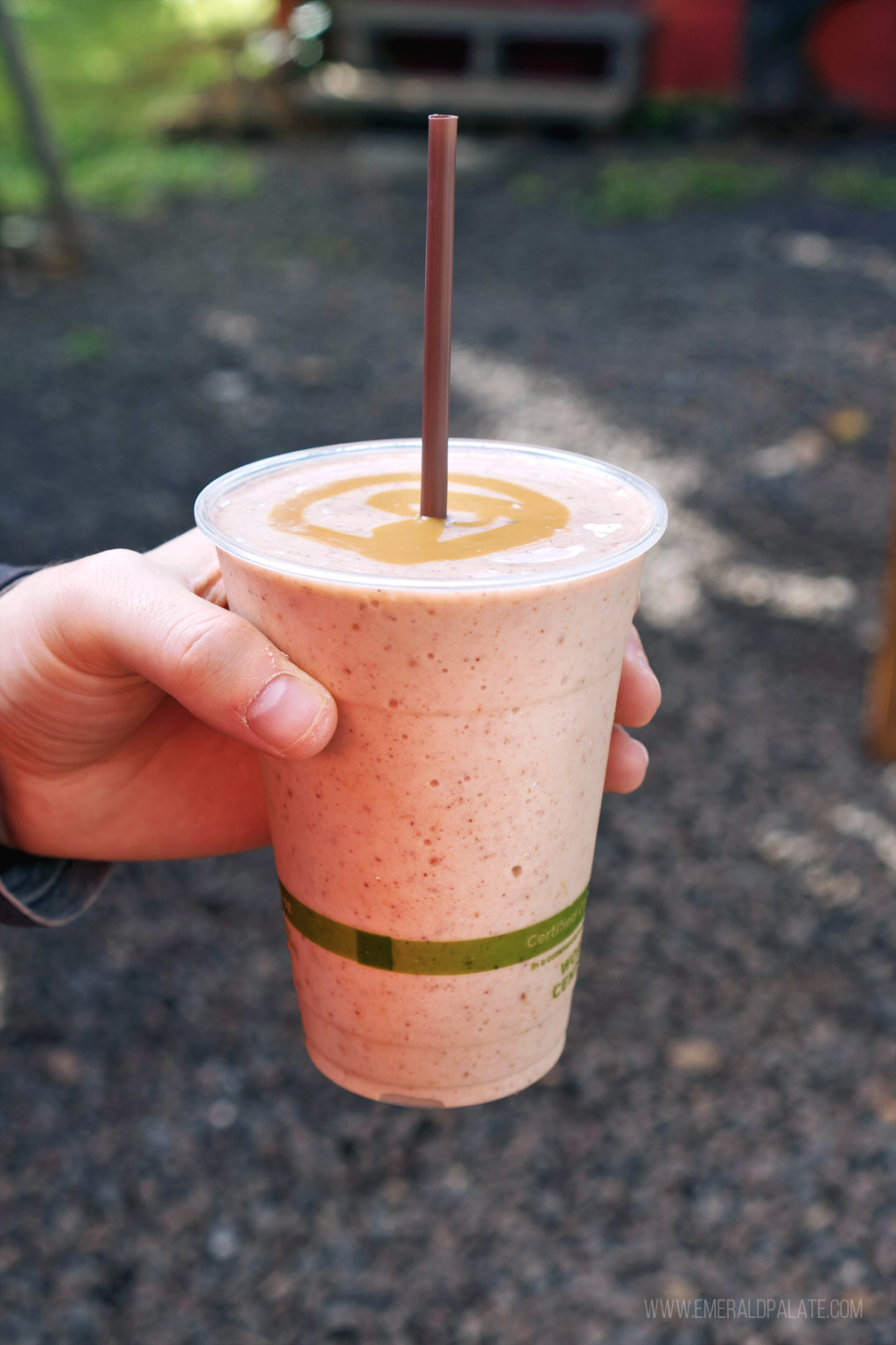 person holding a smoothie