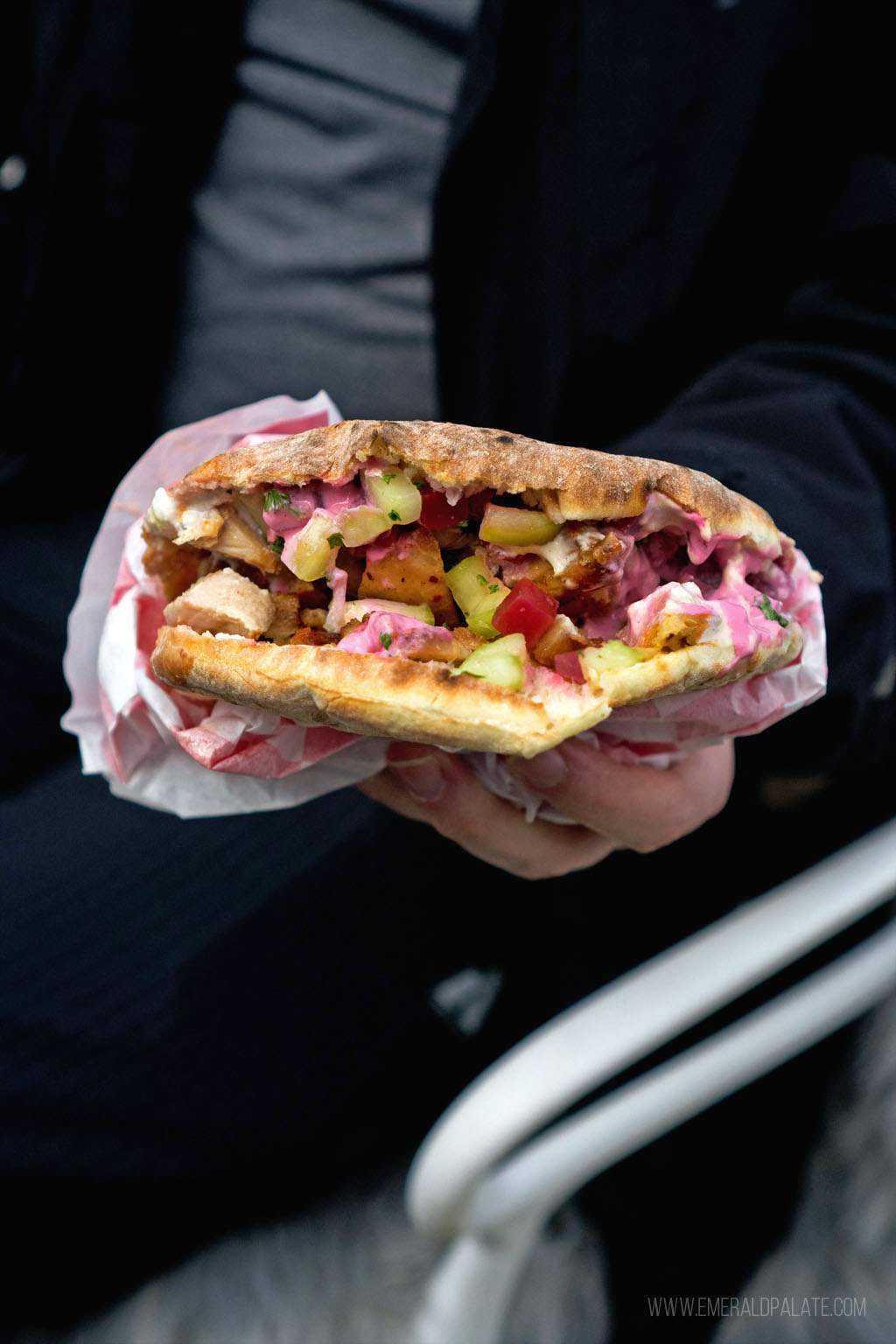 person holding a falafel pita from Bend, OR