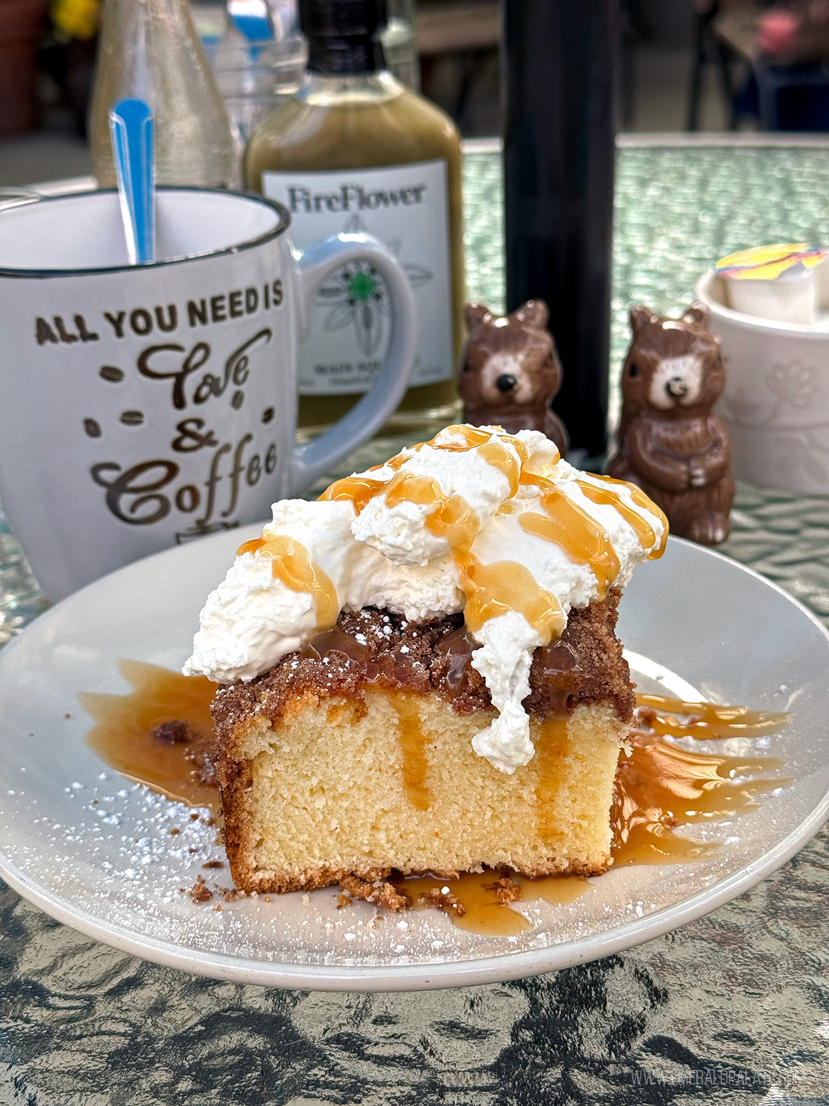 coffee cake piled high with whipped cream and caramel