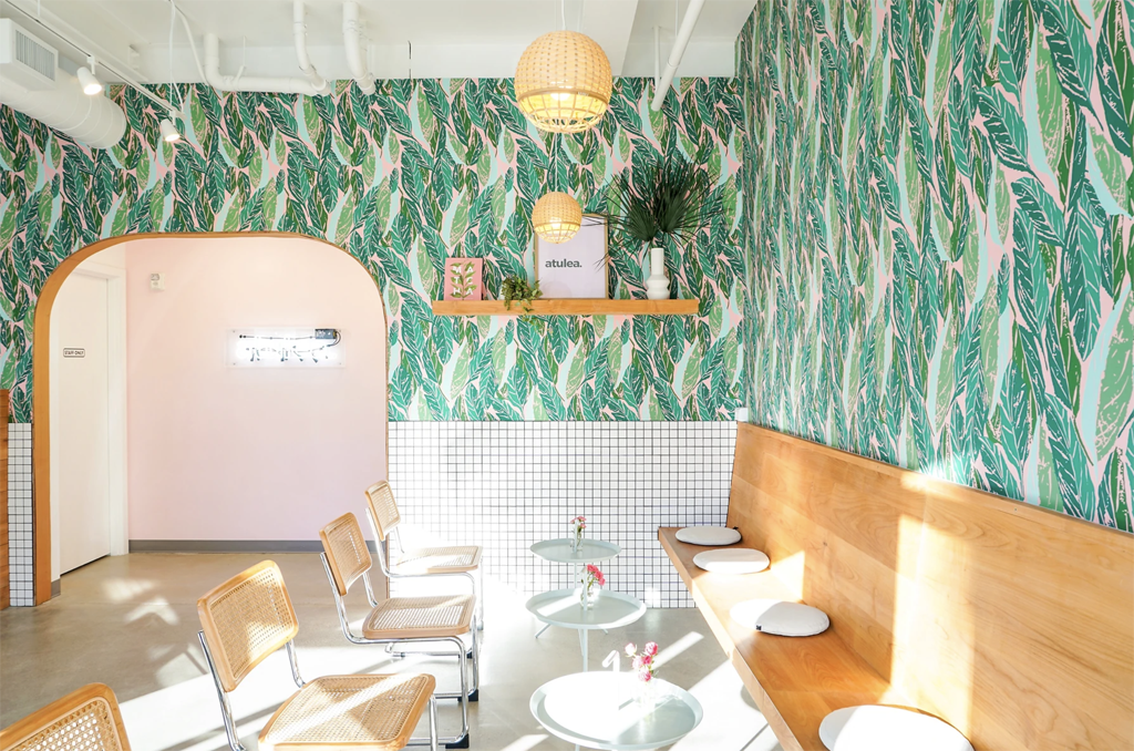 An Instagram worthy restaurant in Seattle with tropic leaf wallpaper