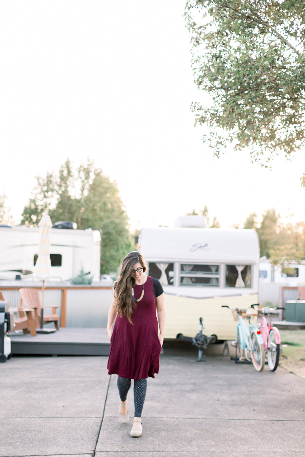 woman walking among vintage trailers at one of the best PNW resorts