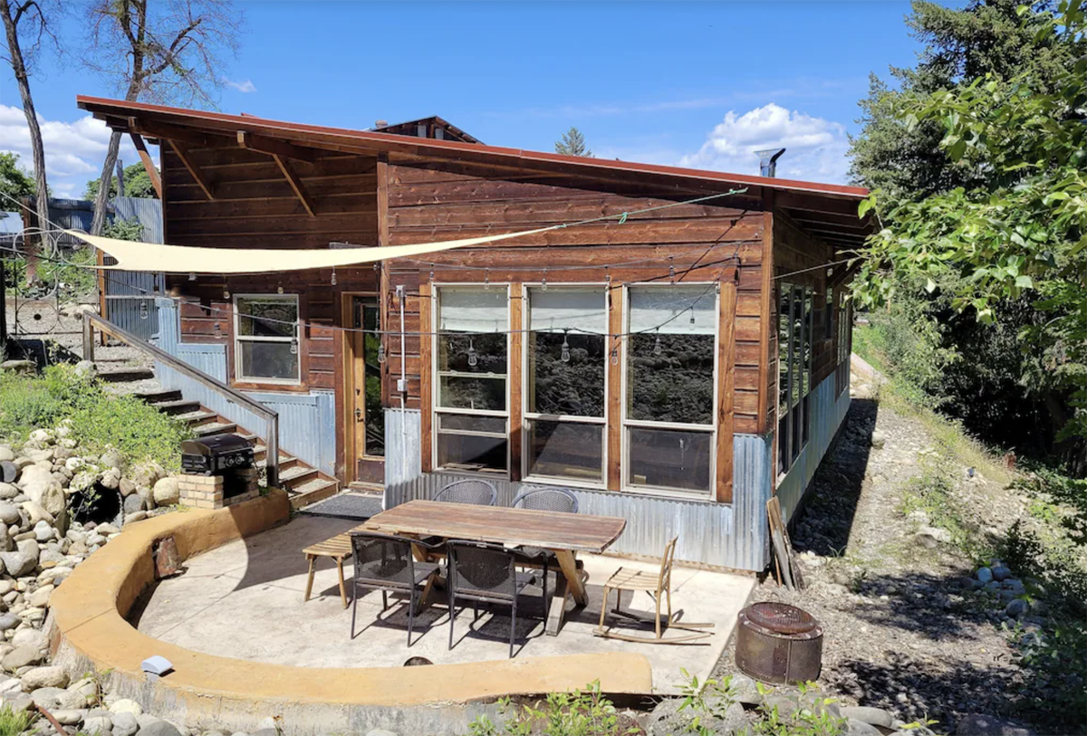 outside a modern cabin with outdoor seating in Winthrop, Washington