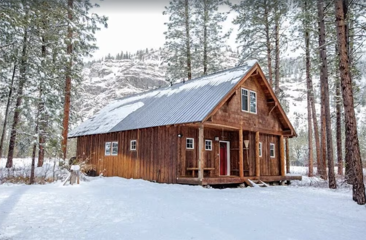 pretty cabin nestled in snow
