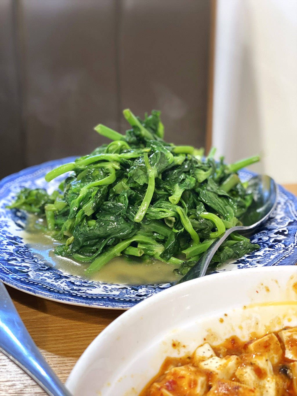 sauteed pea vines from a Chinese restaurant that's one of Seattle's hidden gems for the best Chinese food in Seattle