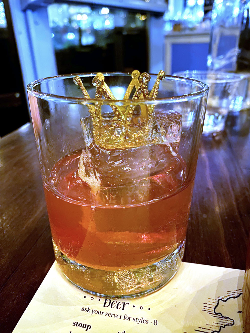 cocktail with a crown in it from a speakeasy in Seattle