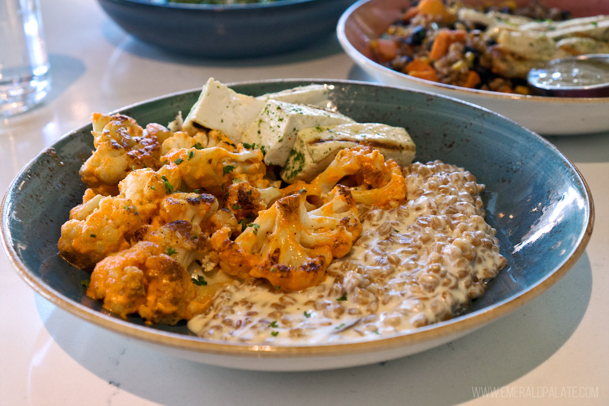 bowl of spicy cauliflower with mac and cheese farro