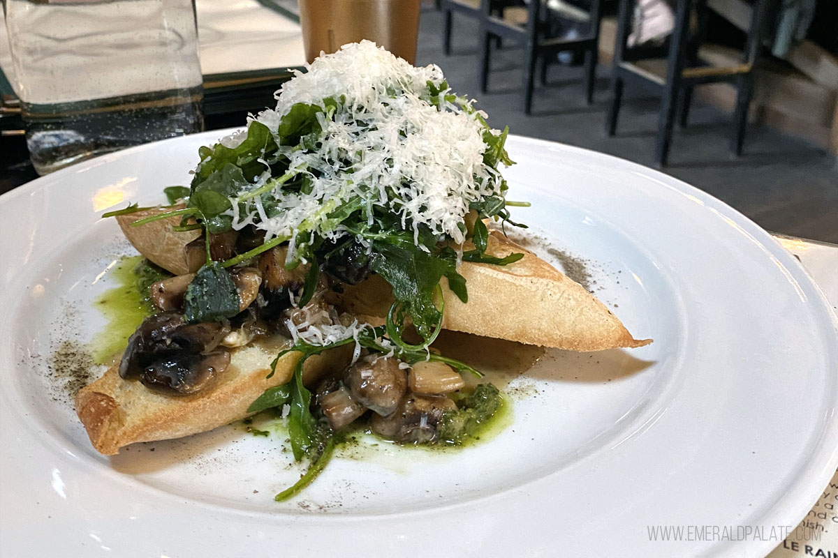 mushrooms on toast heaping with greens