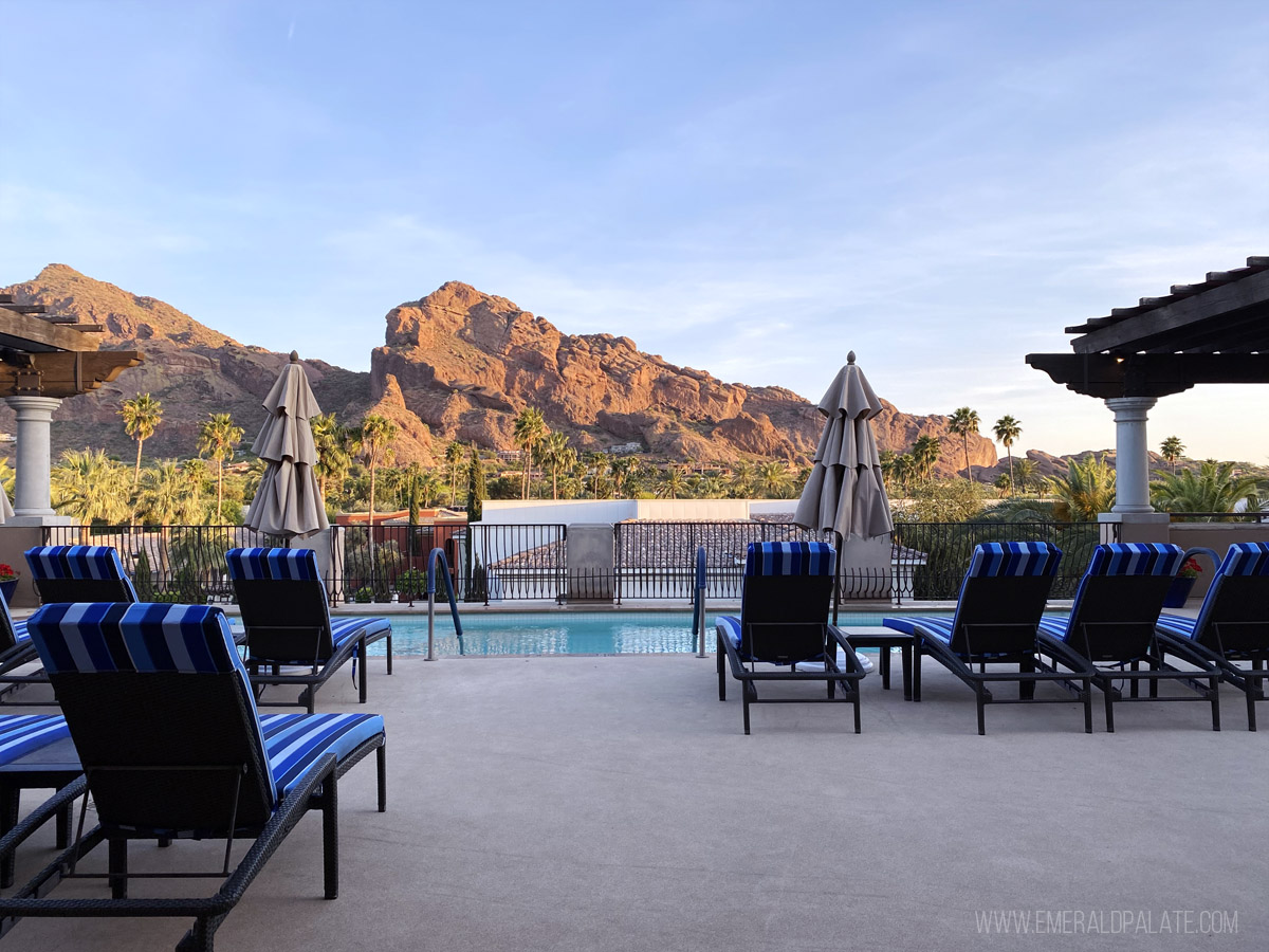 outdoor pool with Camelback Mountain during golden hour in the distance