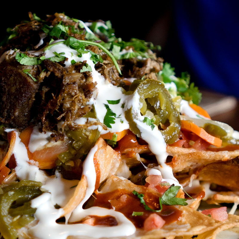 heaping stack of the best nachos in Seattle