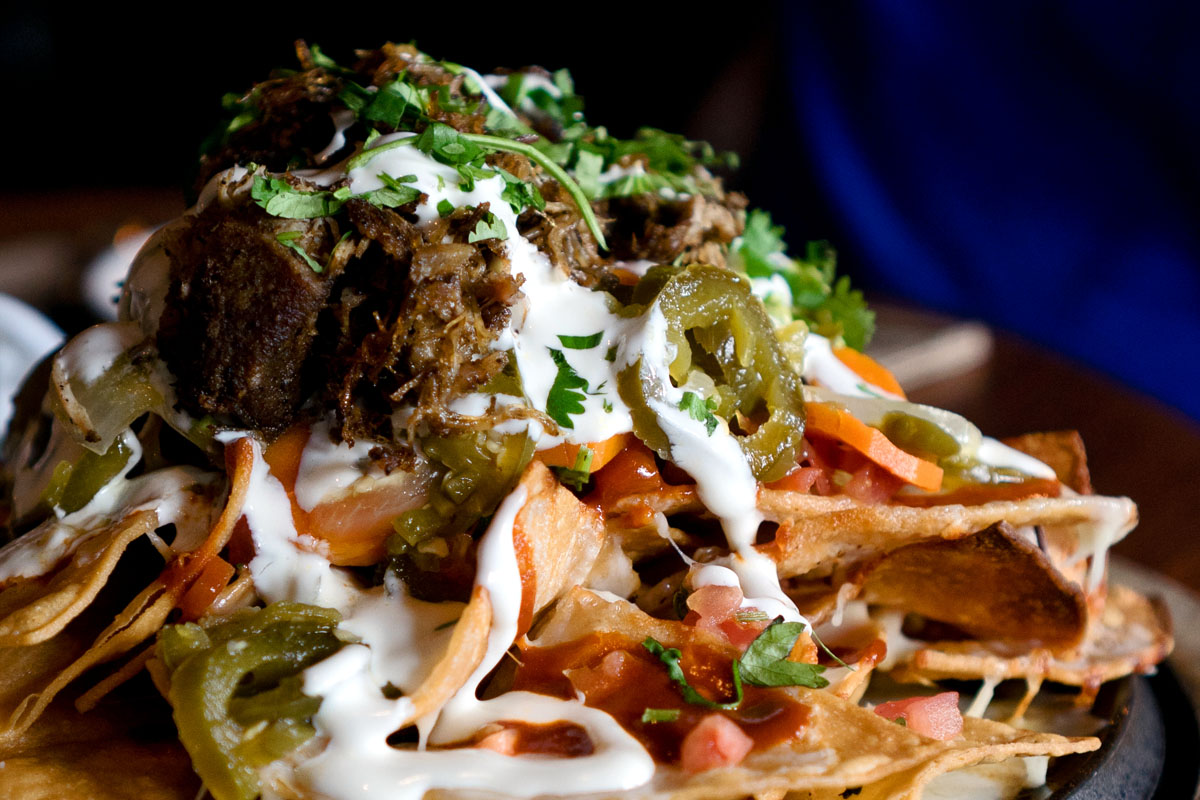 heaping stack of the best nachos in Seattle