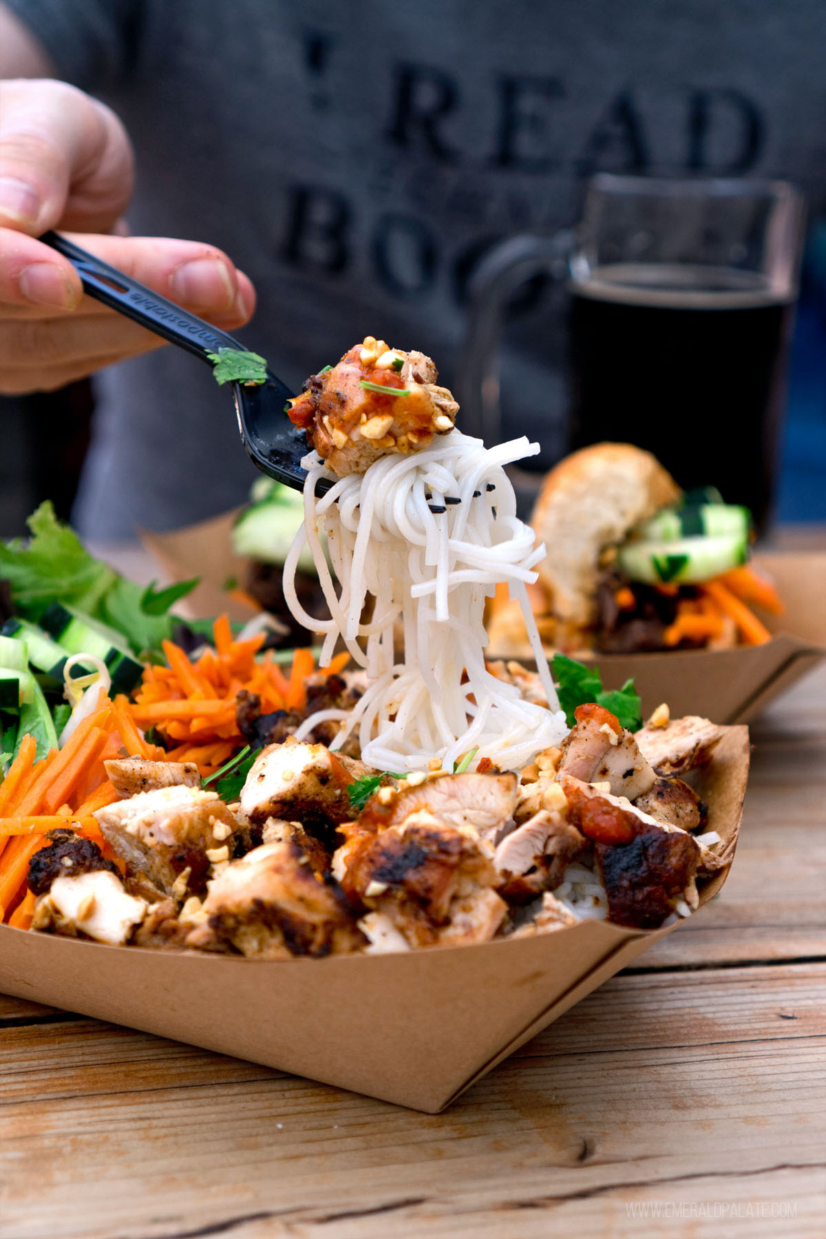 person picking up noodles with a fork from a Eugene restaurant