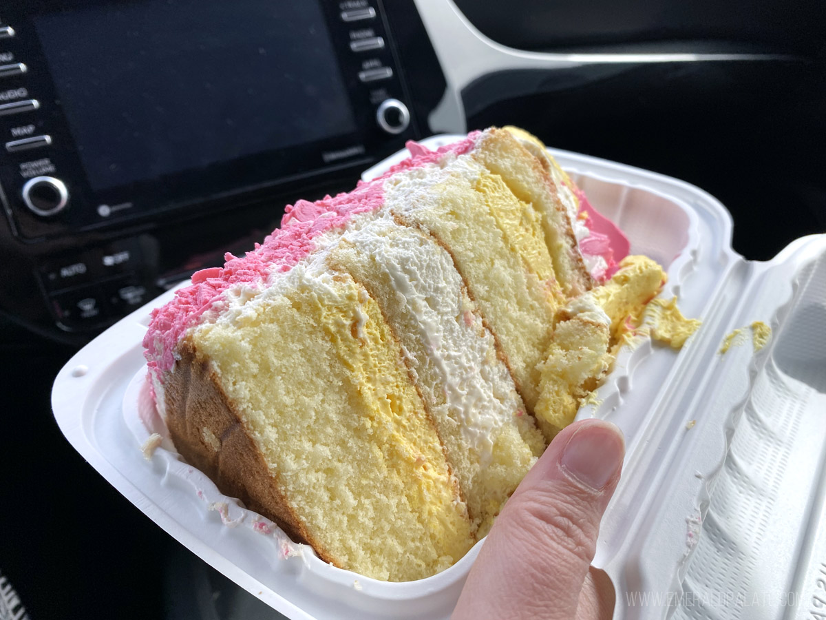 Madonna Inn cake in a takeout container, one of the best things to do in San Luis Obispo