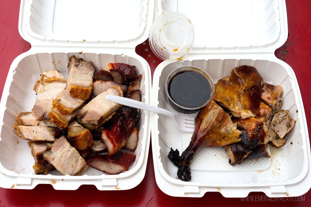 takeout containers of roast and BBQ pork and duck, some of the best Chinese food in Seattle