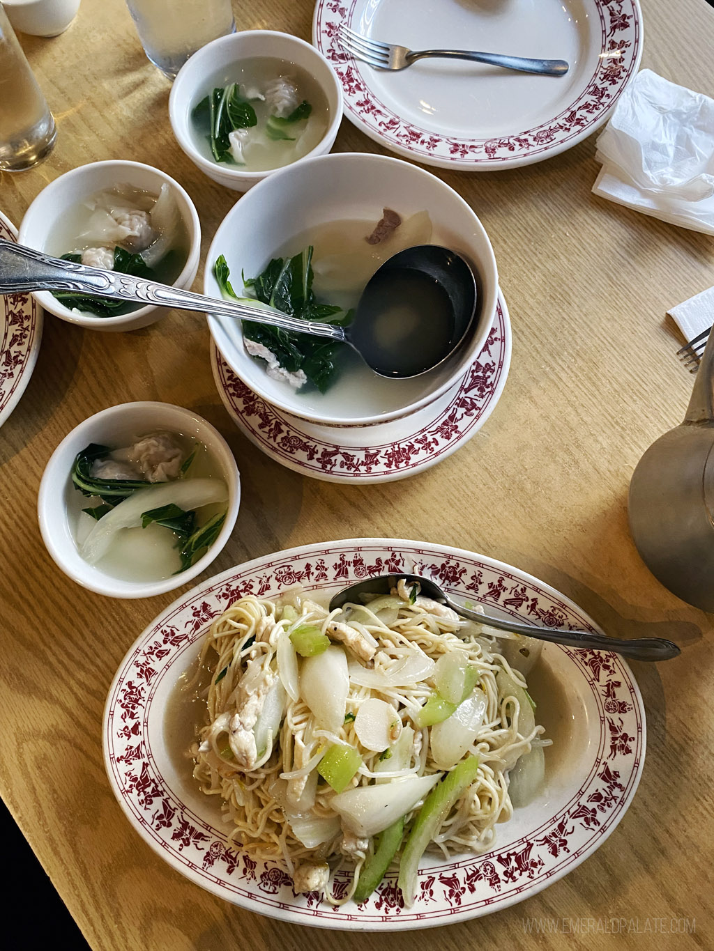 table full of plates of some of the best Chinese food in Seattle