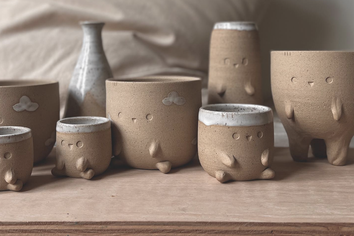 series of cute planters with little faces on them