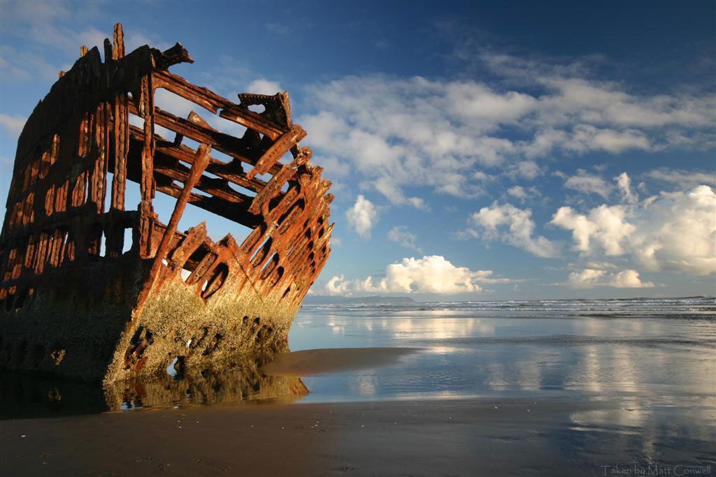 shipwreck on a beach in Astoria, Oregon, one the most most romantic getaways in the Pacific Northwest