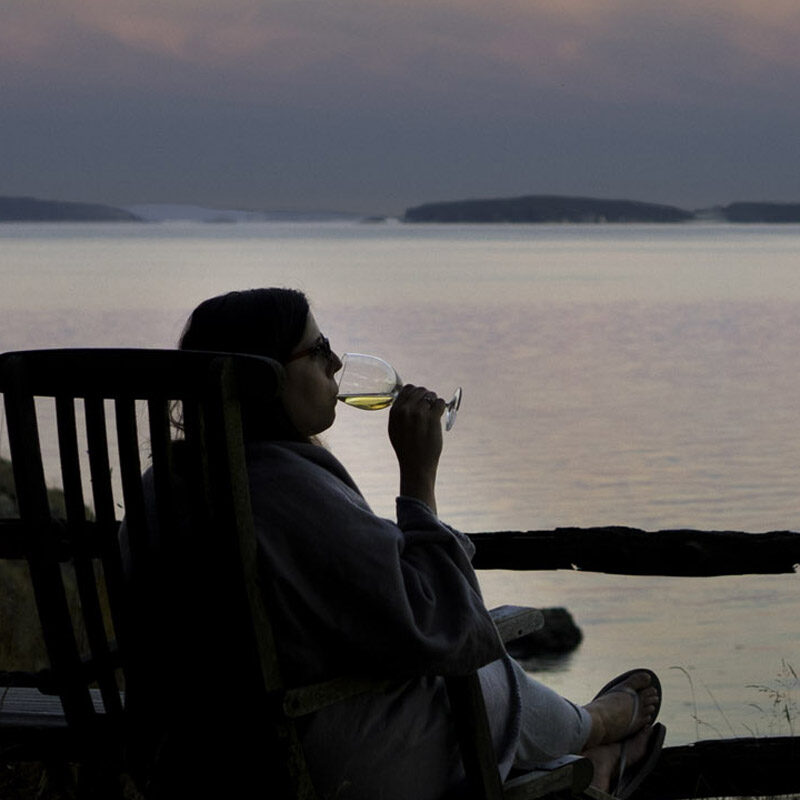 woman drinking wine while vacationing at one of the most romantic getaways in the Pacific Northwest