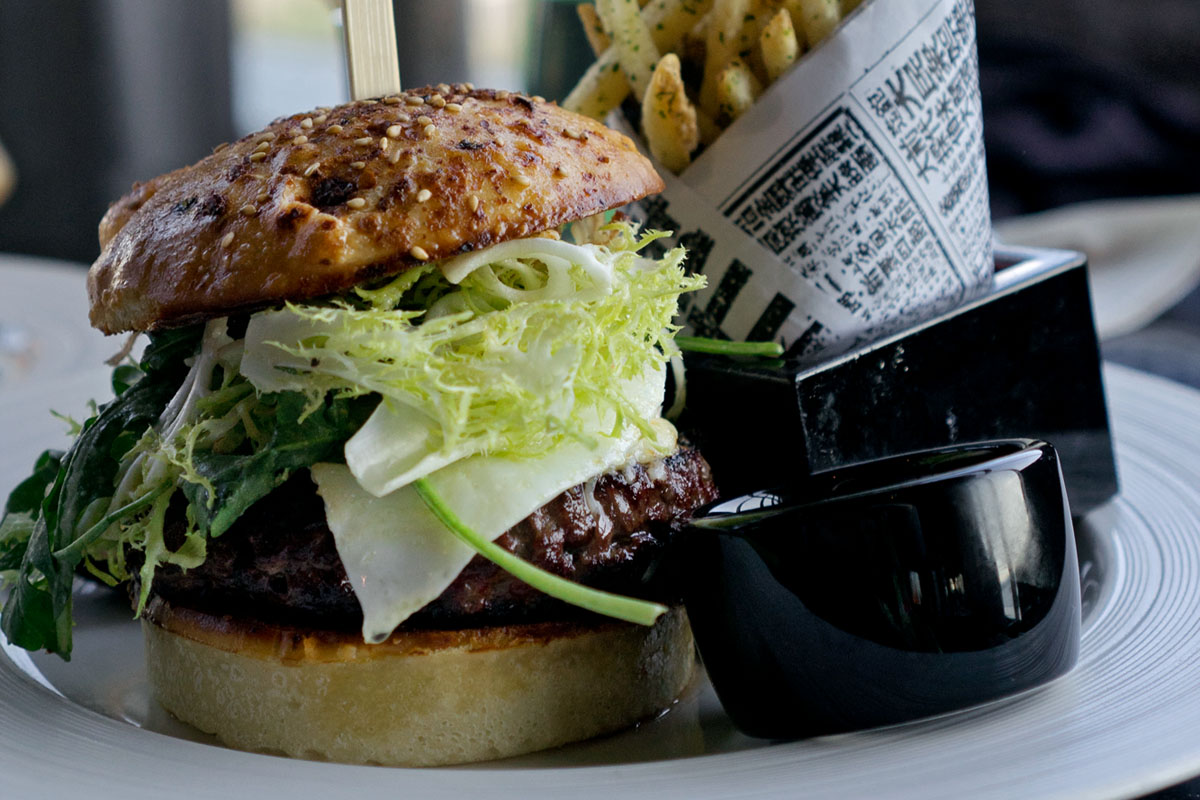 burger and fries from one of the best happy hour places in Seattle